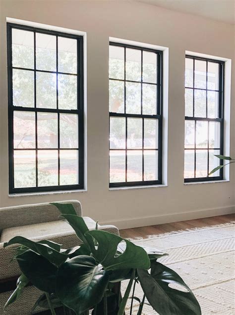 black metal windows front of house|modern black windows interior.